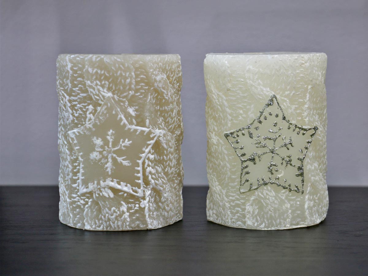white candle with snowflake