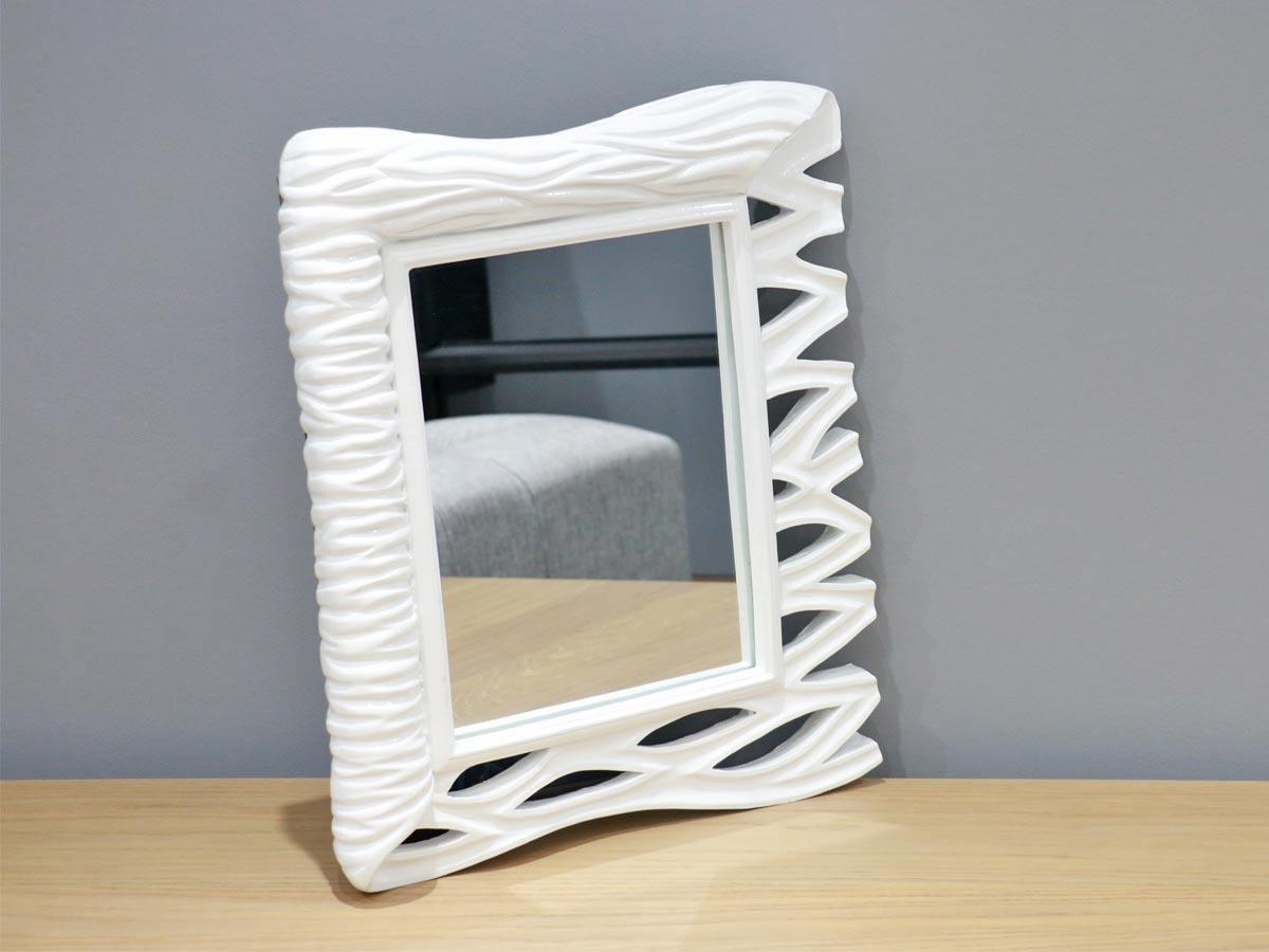 white frame mirror with wave design