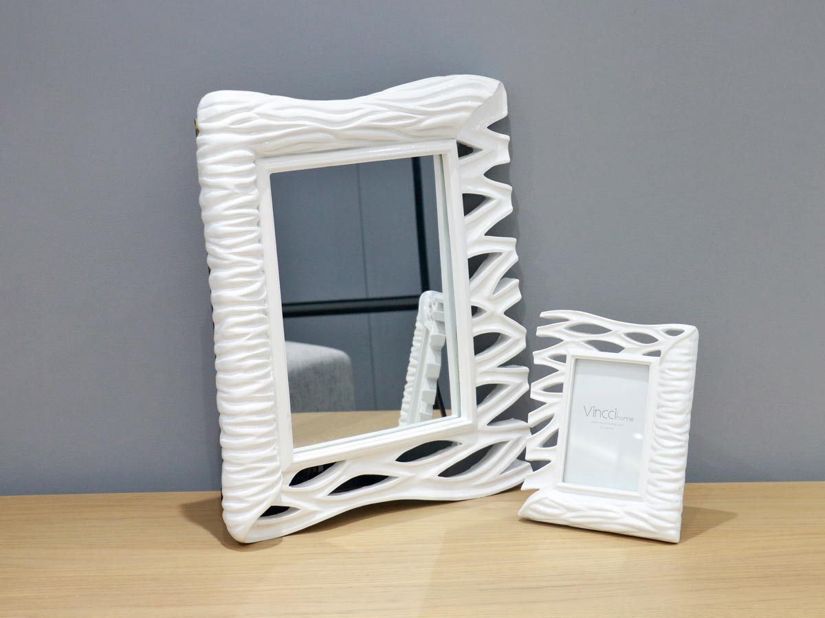 white frame mirror with wave design