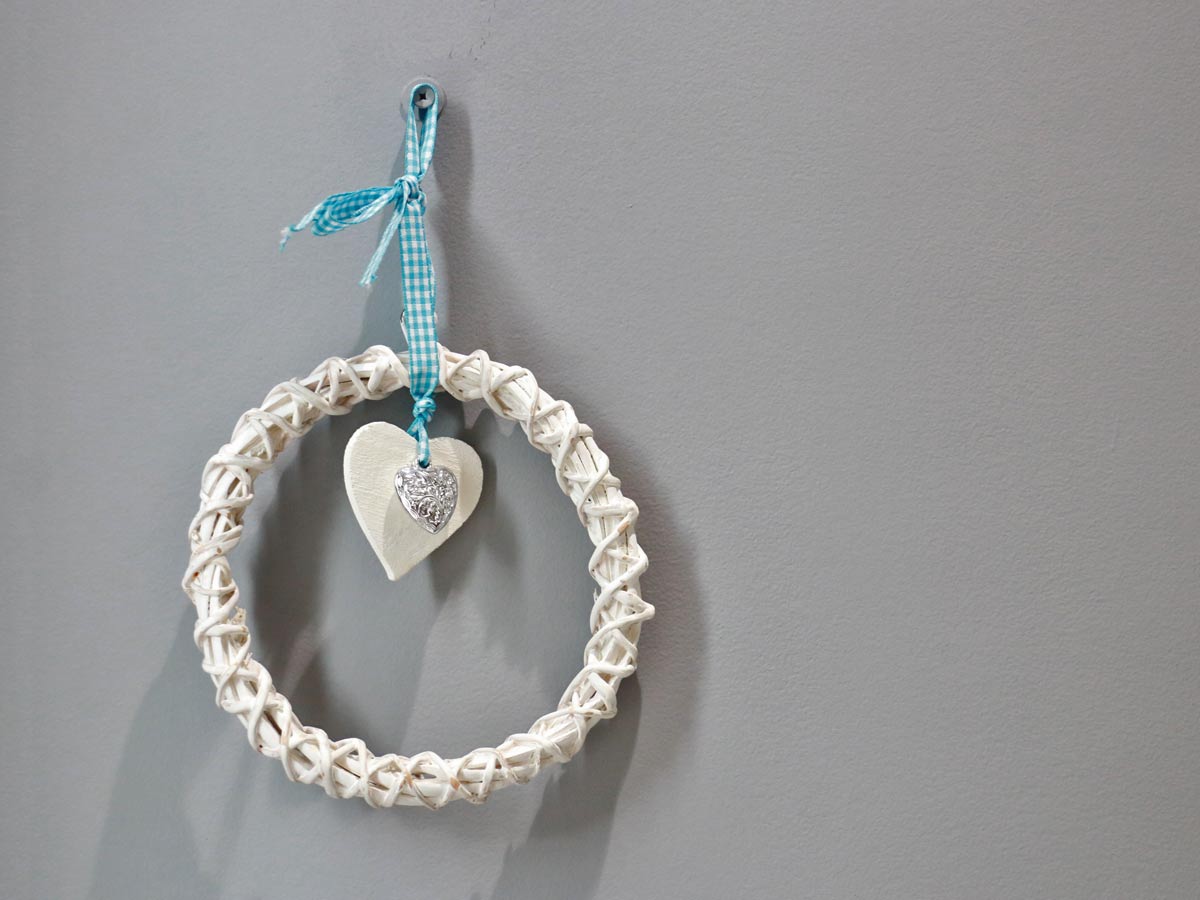 white ring with wooden and silver hearts