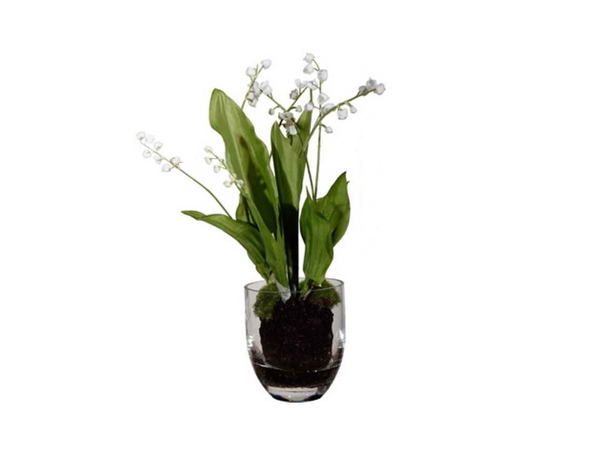 artificial plant in glass pot