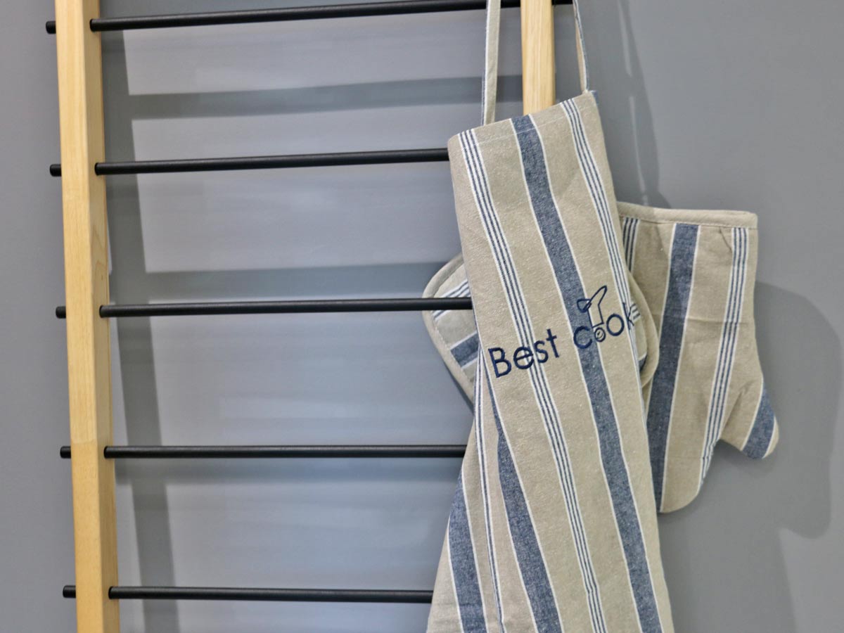 blue set of cotton apron with gloves and pot holder