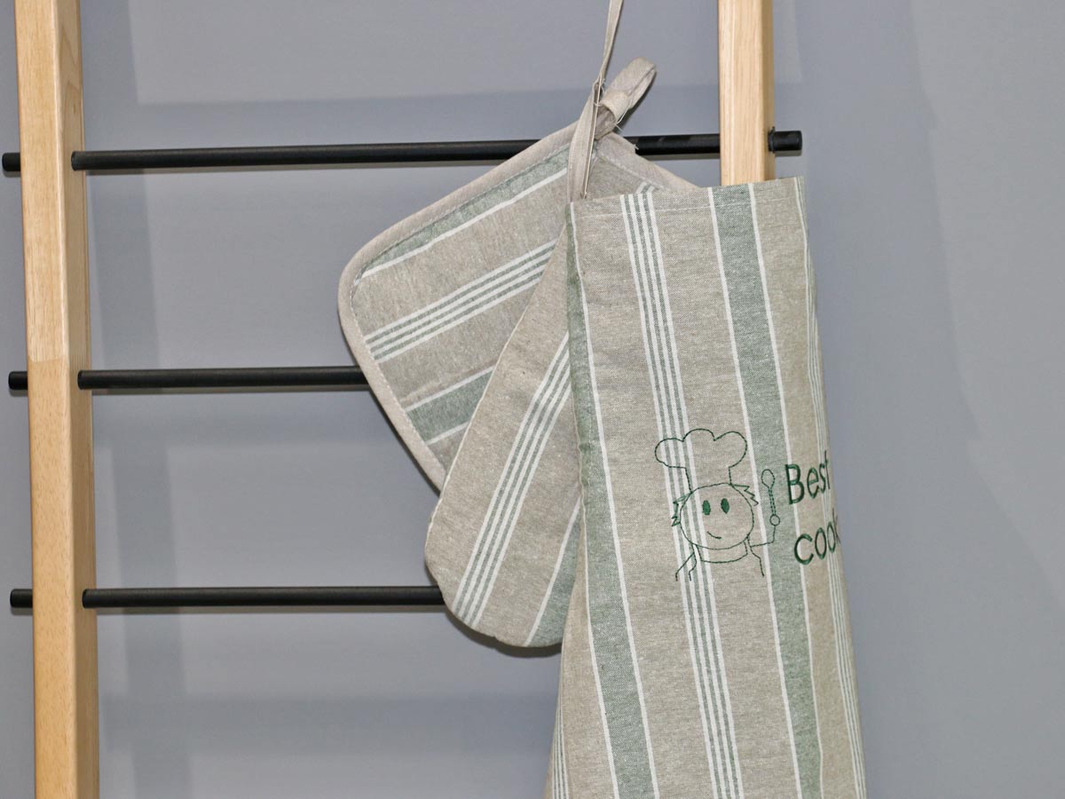 green set of cotton apron with gloves and pot holder