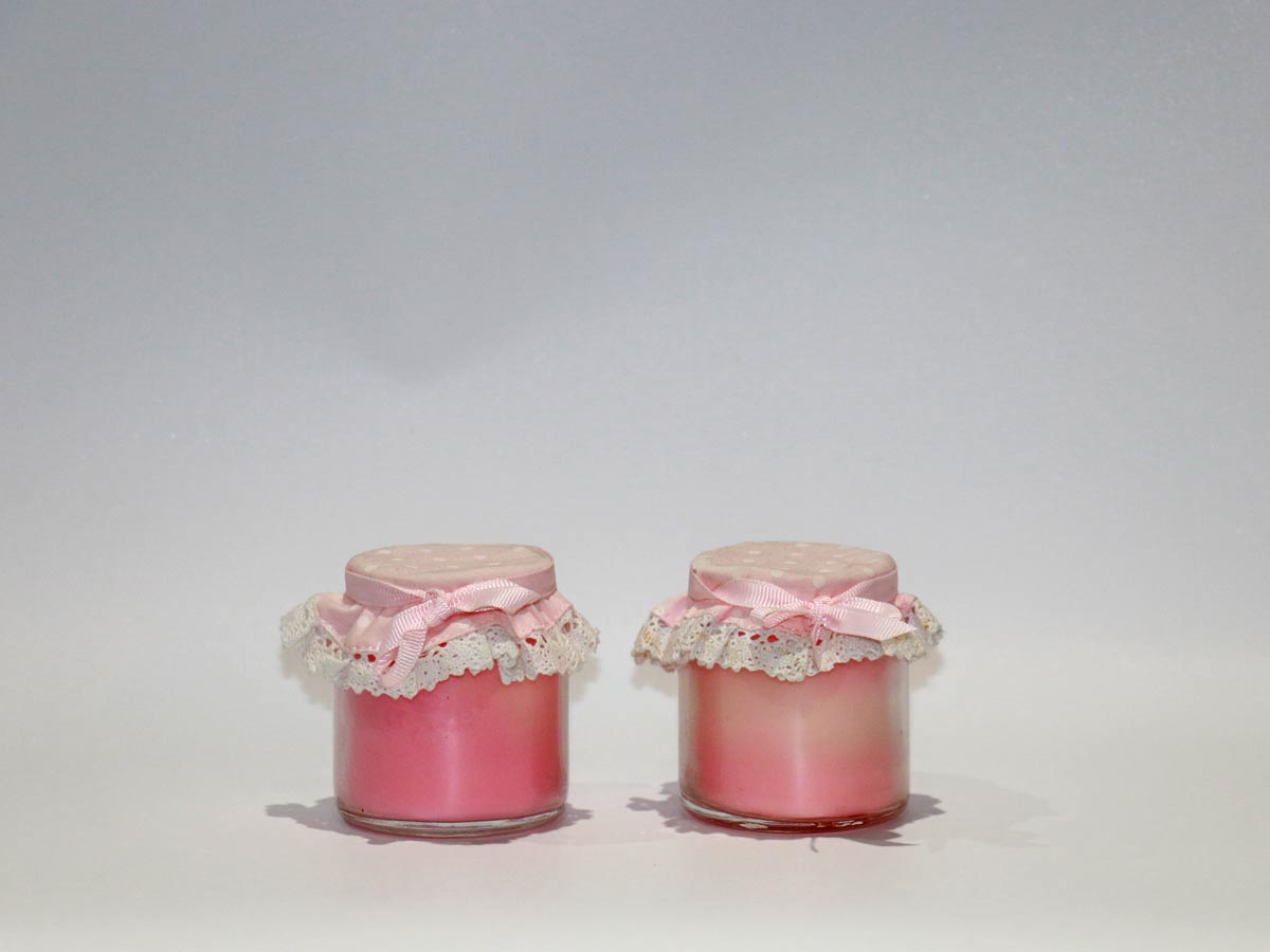 scented pink candles in jars
