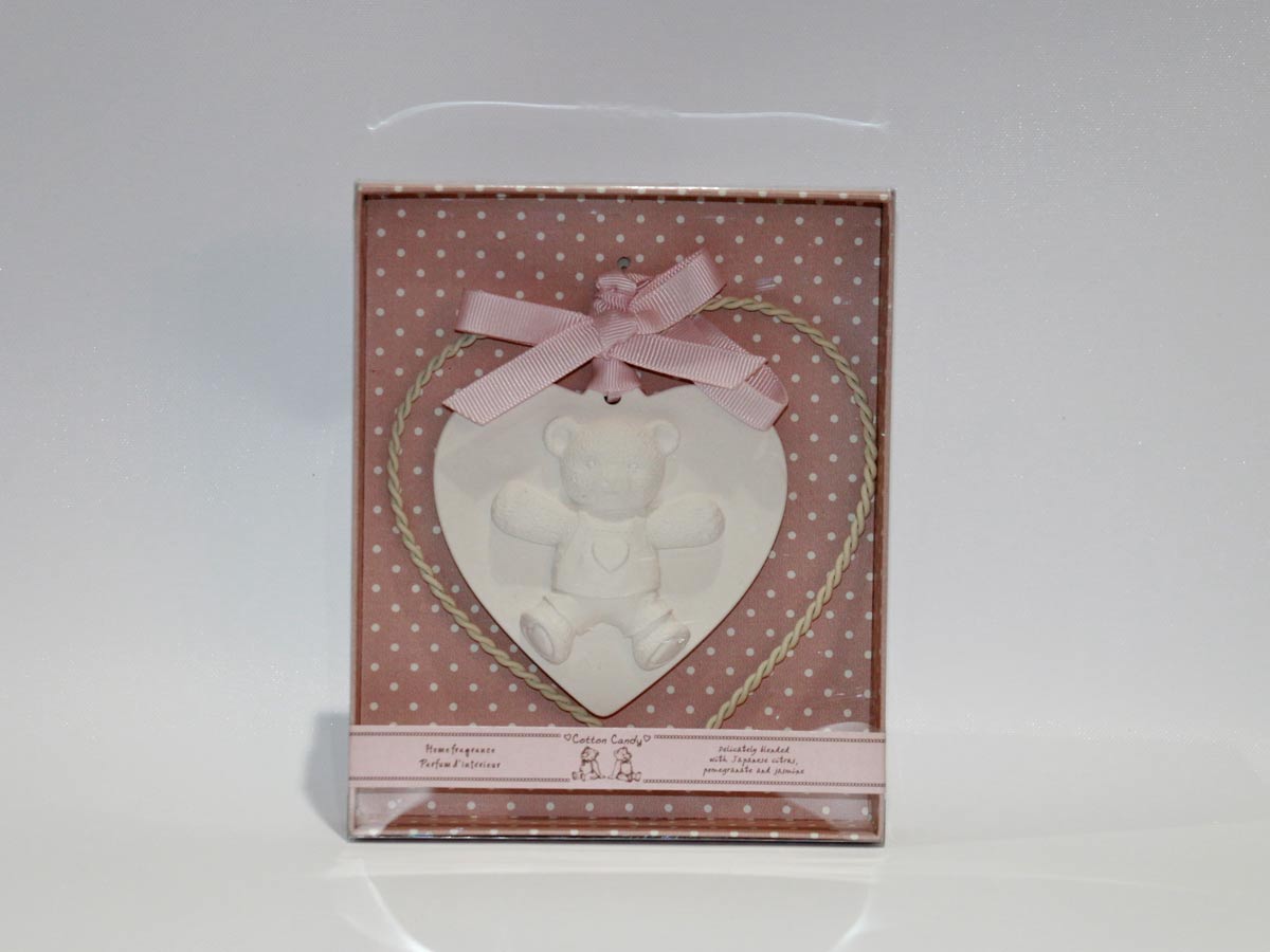 plaster teddy bear with metal heart