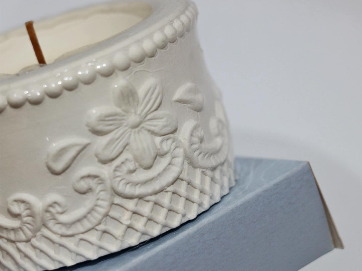embossed pot design with candle