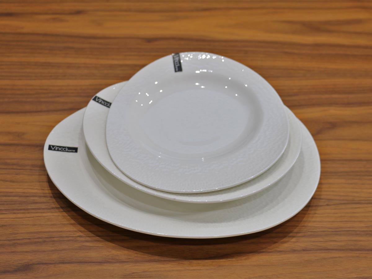 white glossy salad plate with raised design 21cm