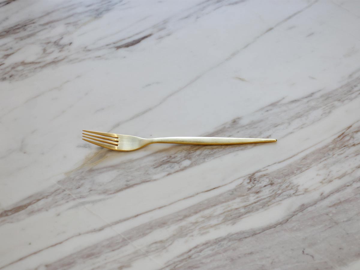 golden stainless steel dessert fork with matte finish