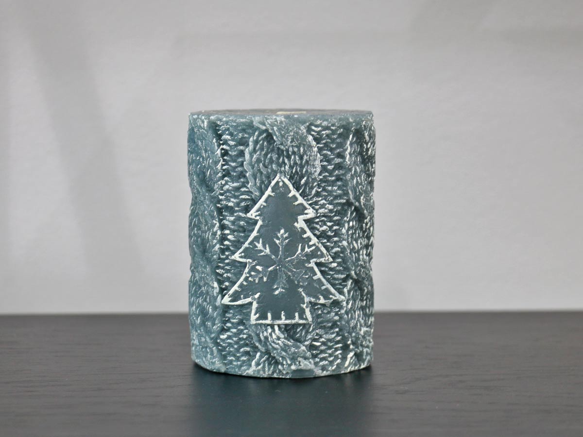 grey candle with christmas tree design