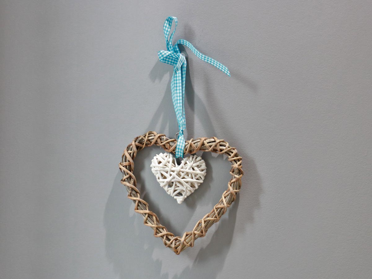 wooden and white heart with ribbon