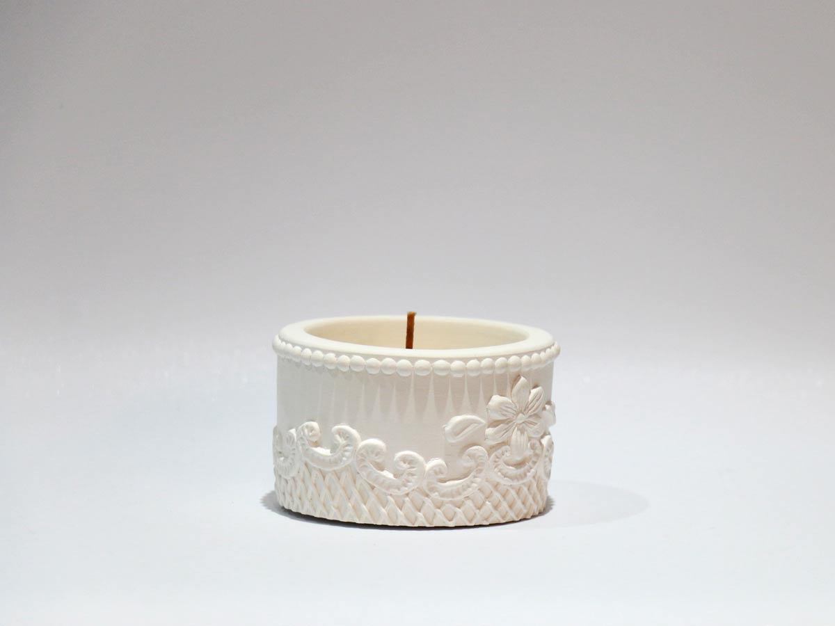 embossed pot design with candle