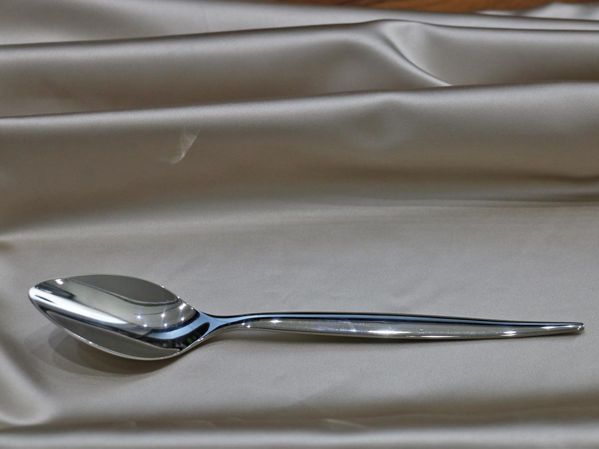 shiny silver-colored stainless steel table spoon