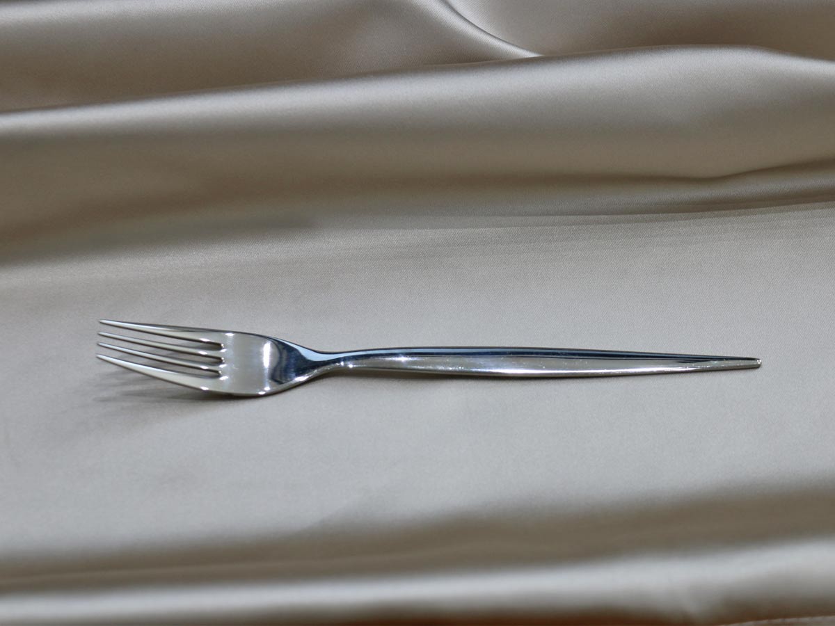 shiny silver-colored stainless steel dessert fork