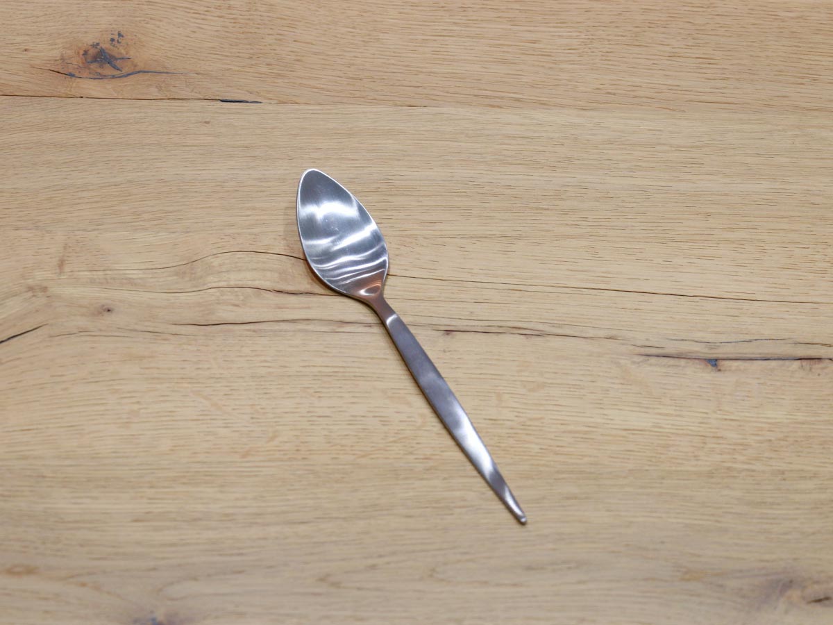 matte silver-colored stainless steel table spoon