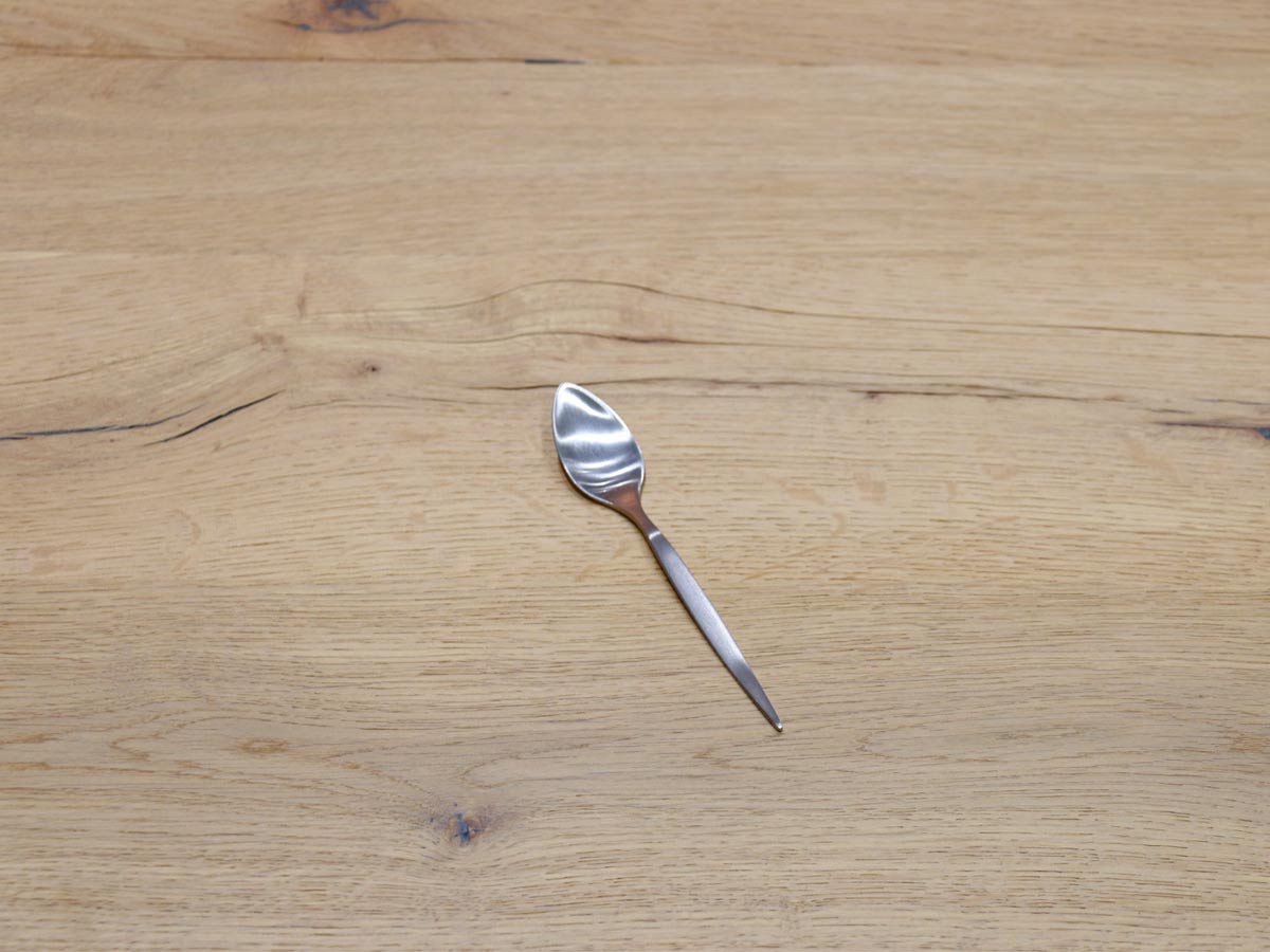 matte silver-colored stainless steel tea spoon