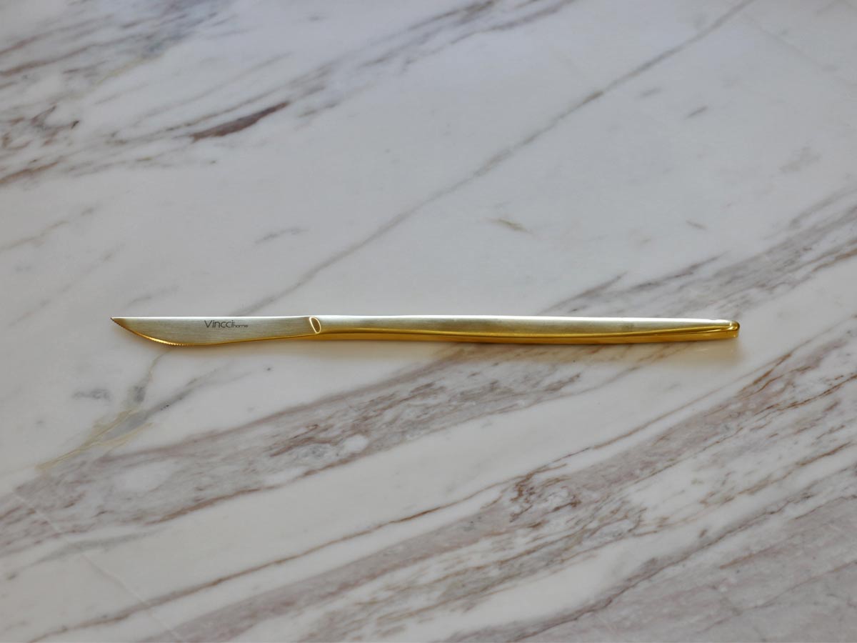 golden stainless steel table knife with matte finish