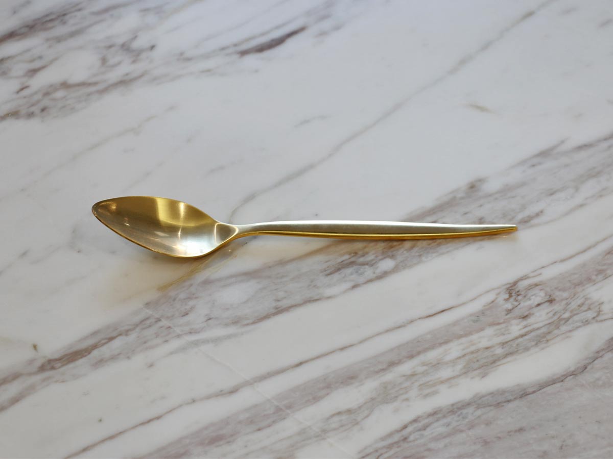 golden stainless steel table spoon with matte finish