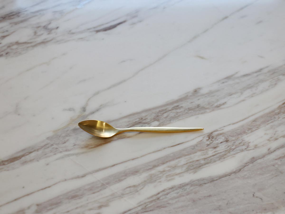 golden stainless steel tea spoon with matte finish