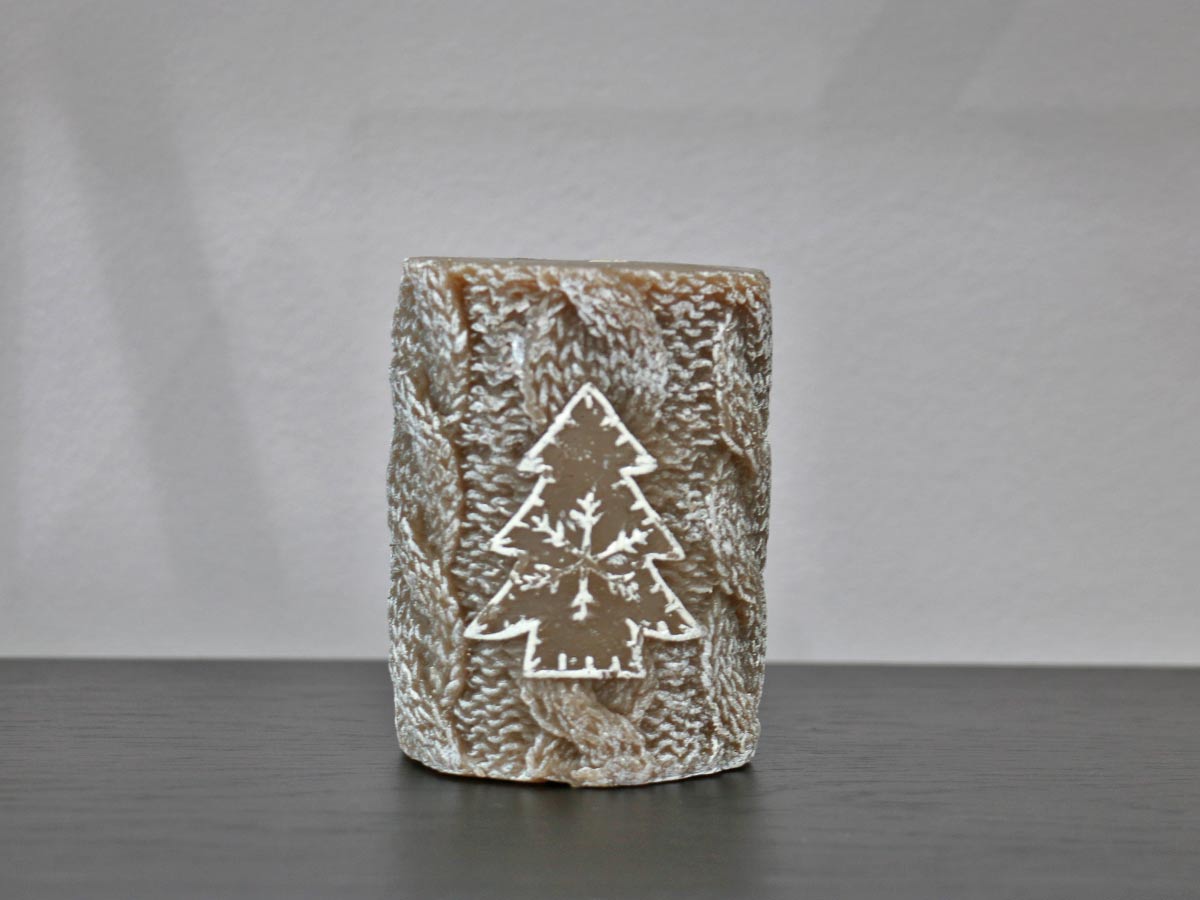 brown candle with christmas tree design